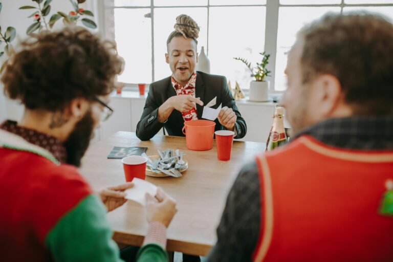 A group of friends playing a Christmas-themed game at a table